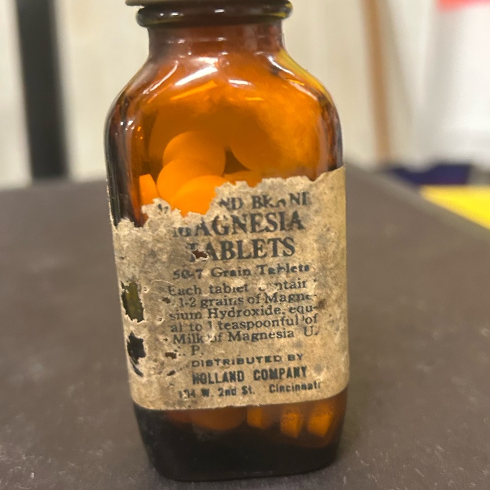 Vintage Brown Glass Bottle with Orange Tablets